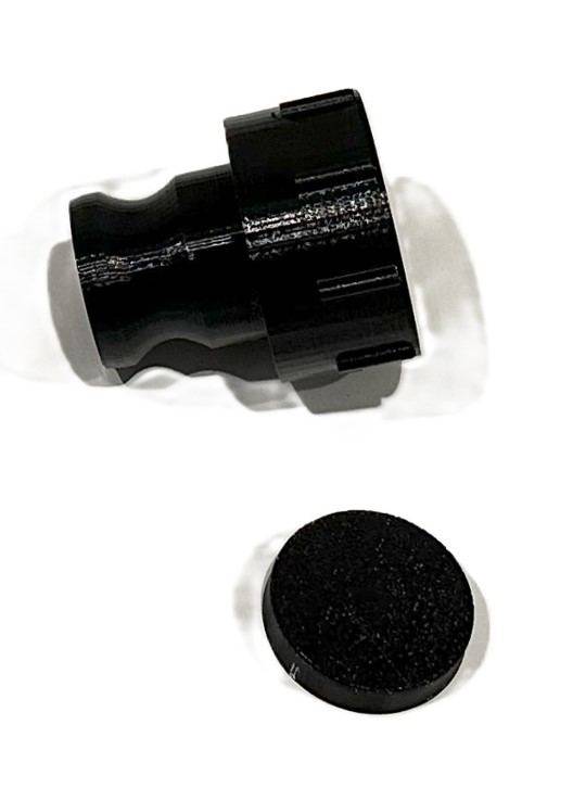 Black 3D-printed external kitchen sink adaptor and cap for a Scout 15 caravan